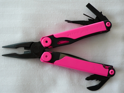Hot pink powdercoated Leatherman front view pliers with tools spread